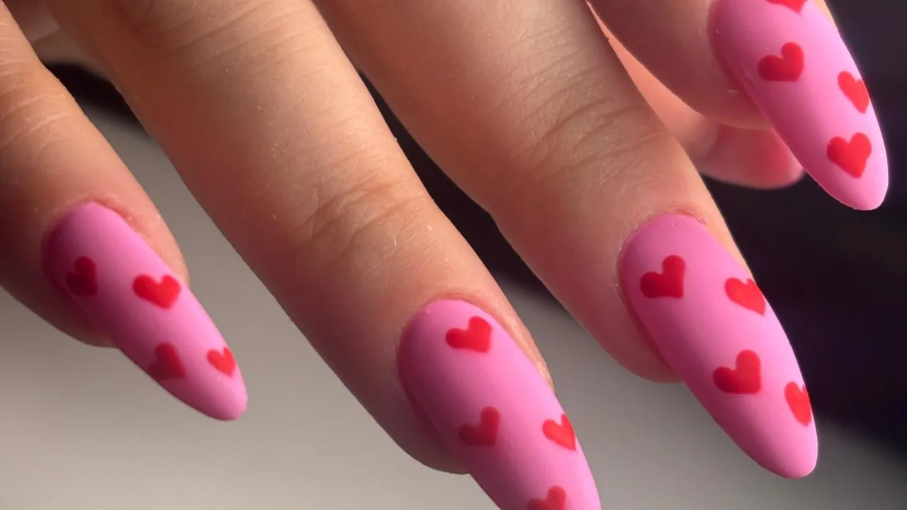 Pink nails with red hearts