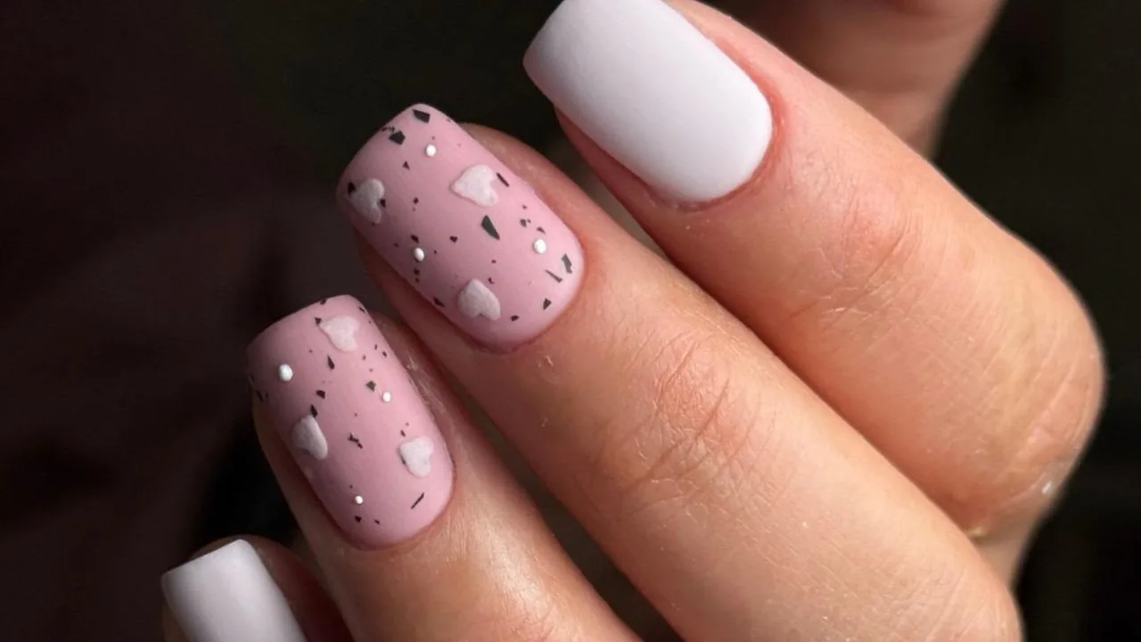 Blush speckled nails with white accents