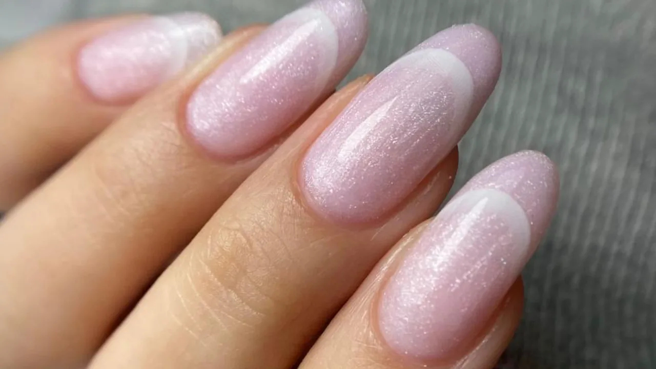 Sheer pink shimmer almond nails