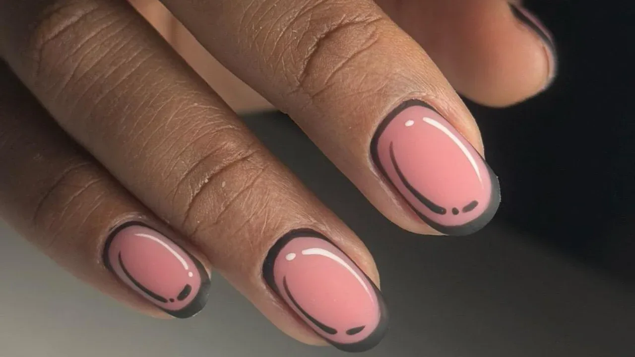 Peach nails with a black outline pop art effect