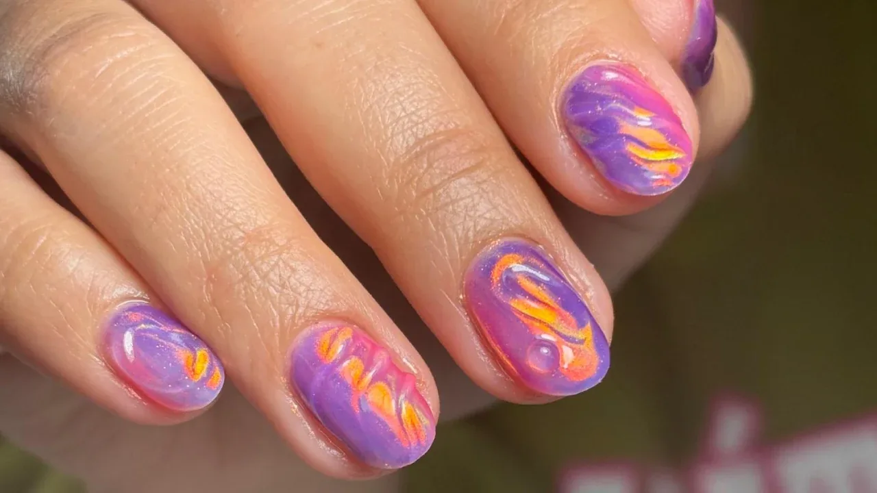 Purple and orange marbled nails