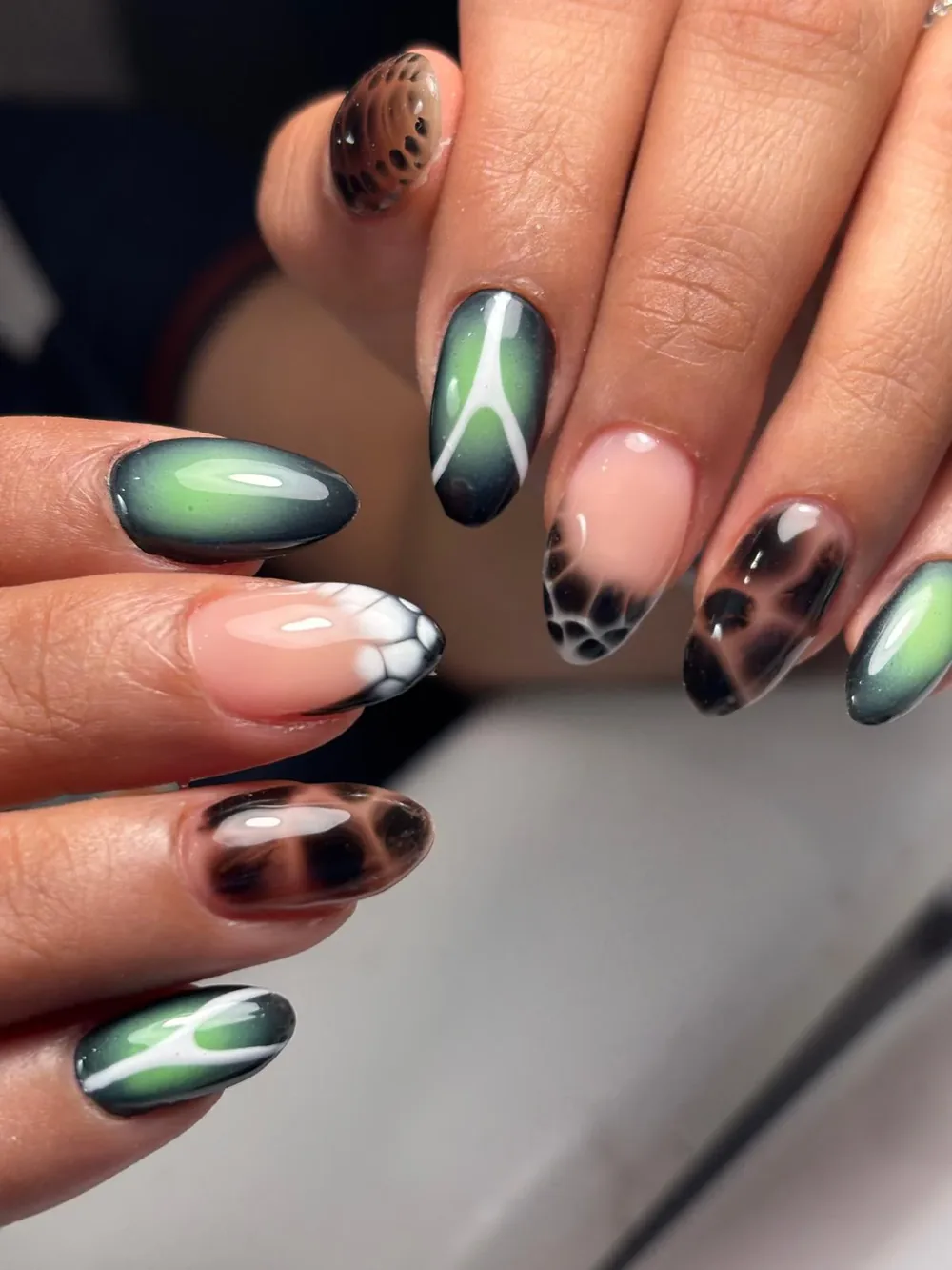 Green aura and tortoiseshell mix-and-match nails