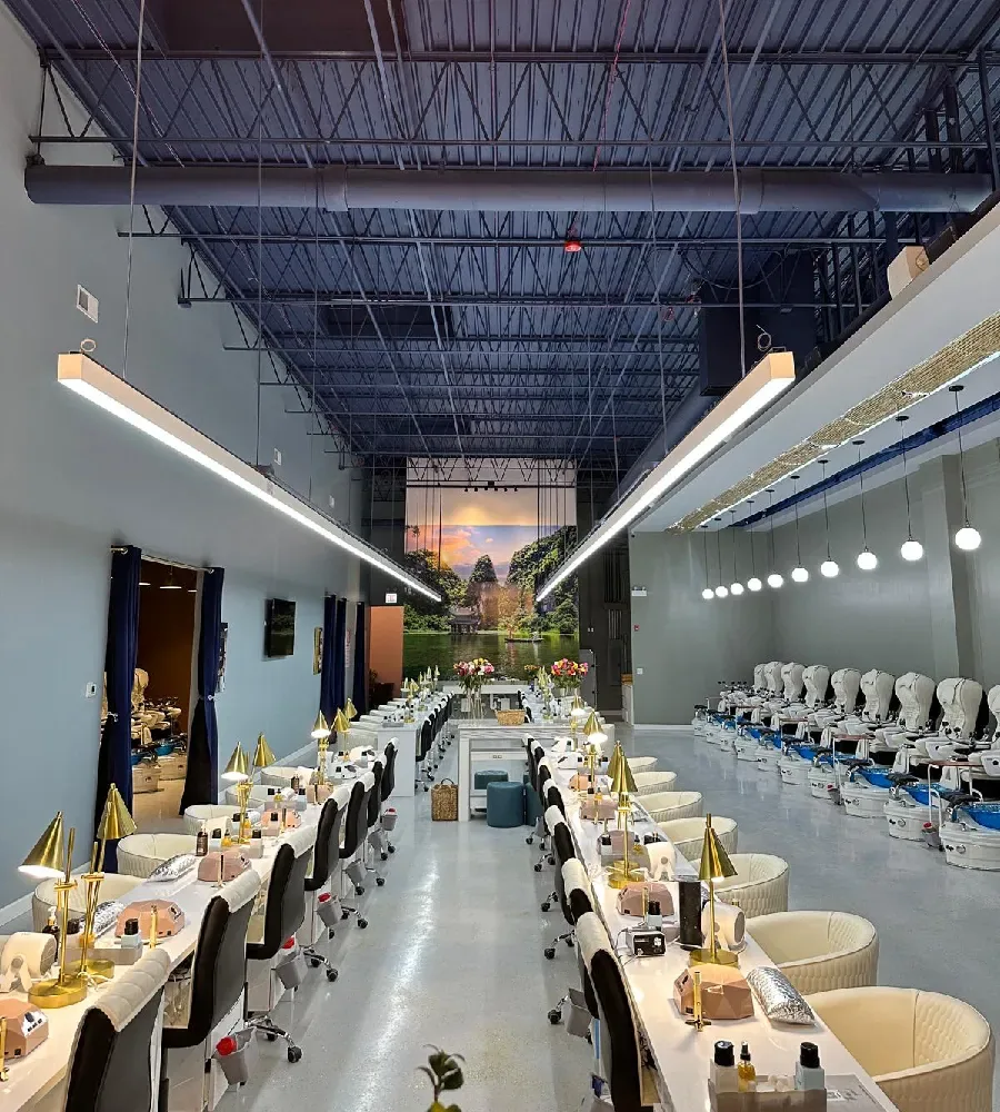The long, light-filled hall of Luxo Nail Spa in Avondale, Chicago